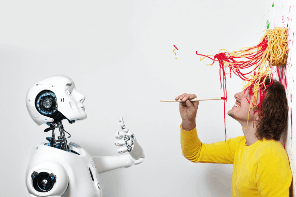 A confused robot watching a smiling human paint the wall with spaghetti